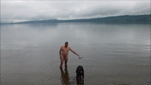 MAN TRYING TO TRAIN HIS DOG