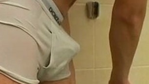 Cute twink Cristian teases his cock over undies in shower