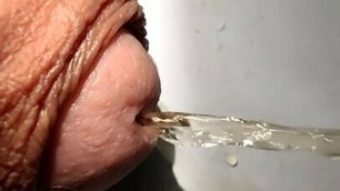 Slow motion piss from big penis