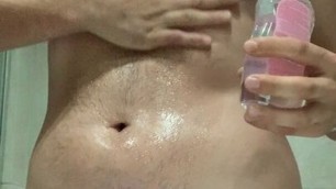 Big Cock Hunk rubbing baby oil over body and cock and having wet wank with big cumshot